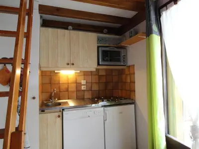 a small kitchen with a sink and a microwave at Charmant appartement 4-6 pers, balcon, proche pistes et commodités - FR-1-572-142 in Arâches-la-Frasse