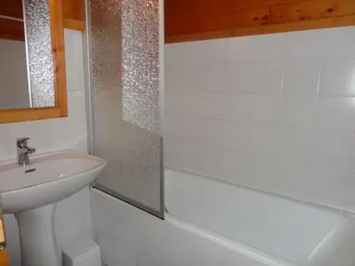 a white bathroom with a sink and a shower at Chalet 3 Chambres 8 Pers, 800m Pistes, Parking Couvert, Poêle à Bois, Quartier Calme - FR-1-572-224 in Arâches-la-Frasse