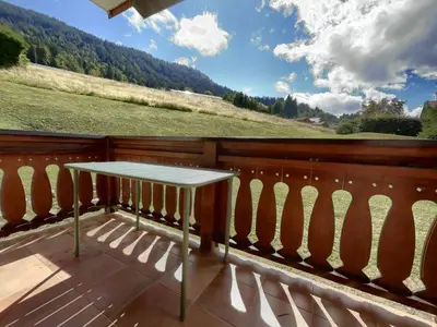 a town covered in snow with mountains in the background at Appartement 2 Pièces Cabine pour 6 pers. avec Balcon - Pied de Piste, Parking Inclus - FR-1-572-261 in Arâches-la-Frasse