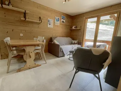 a log cabin in the snow with snow covered trees at Appartement 2 Pièces Cabine pour 6 pers. avec Balcon - Pied de Piste, Parking Inclus - FR-1-572-261 in Arâches-la-Frasse