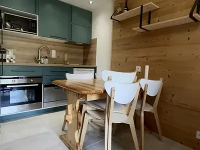 a log cabin with snow on the ground in front at Appartement 2 Pièces Cabine pour 6 pers. avec Balcon - Pied de Piste, Parking Inclus - FR-1-572-261 in Arâches-la-Frasse