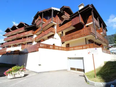 a building with balconies on the side of it at Appartement rénové 2P 4 pers, proche pistes et commerces - FR-1-572-20 in Arâches-la-Frasse