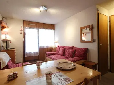 a living room with a couch and a table at Appartement rénové 2P 4 pers, proche pistes et commerces - FR-1-572-20 in Arâches-la-Frasse