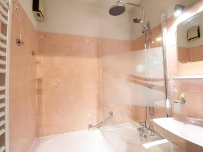 a bathroom with a shower and a tub and a sink at Appartement rénové 2P 4 pers, proche pistes et commerces - FR-1-572-20 in Arâches-la-Frasse