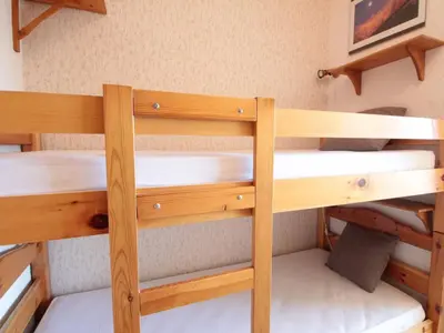 a pair of bunk beds in a room at Studio cosy 4 pers. au pied des pistes avec balcon - Proche centre et commodités - FR-1-572-151 in Arâches-la-Frasse