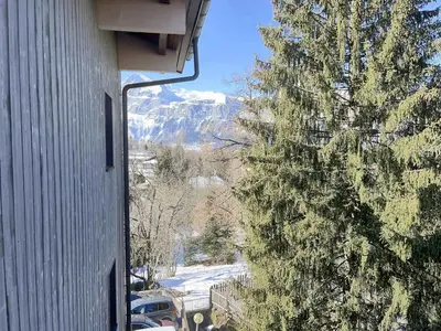 a view of a snow covered mountain from a house at Studio 4 pers. au pied des pistes, balcon, parking, Wi-Fi, proche commerces - FR-1-572-238 in Arâches-la-Frasse