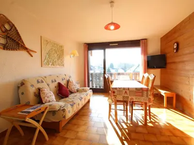 a living room with a couch and a table at Studio spacieux 4 pers avec garage, lave-vaisselle aux Carroz - FR-1-572-159 in Arâches-la-Frasse