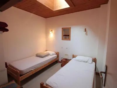 two beds in a room with a ceiling at Appartement Duplex 4 pièces pour 6 pers, sur les pistes avec WiFi et parking, proche commerces - FR-1-572-62 in Arâches-la-Frasse