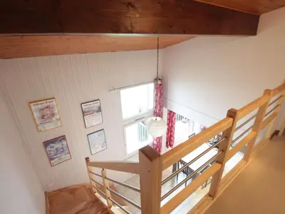 a staircase in a room with a window at Appartement Duplex 4 pièces pour 6 pers, sur les pistes avec WiFi et parking, proche commerces - FR-1-572-62 in Arâches-la-Frasse