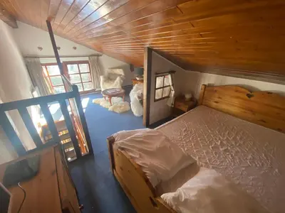 a bedroom with a bed and a wooden ceiling at Appartement face Mont Blanc in Demi-Quartier