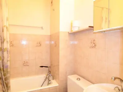 a bathroom with a tub and a sink and a toilet at Studio 4 pers à 100m des pistes, proche commerces - FR-1-572-219 in Arâches-la-Frasse