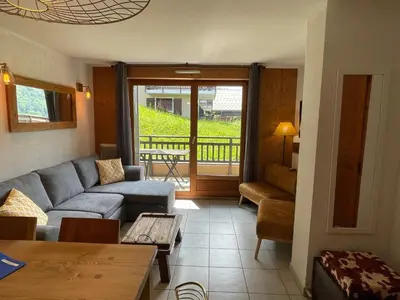 a bedroom with a large bed and a window at Apartment Joly-Vue in Saint-Gervais-les-Bains