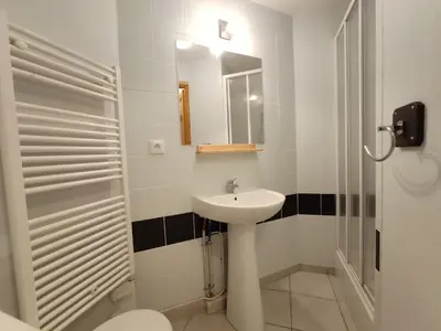 a bedroom with two bunk beds and a chair at Apartment Joly-Vue in Saint-Gervais-les-Bains