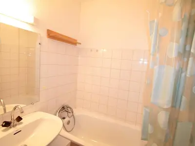 a bathroom with a sink and a tub and a shower at Studio central village aux Carroz, animaux admis, 5 pers - FR-1-572-202 in Arâches-la-Frasse