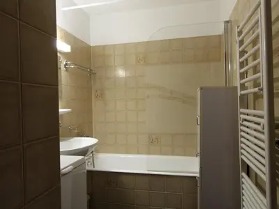 a bathroom with a tub and a sink at Studio au pied des pistes avec terrasse – 4 pers, lave-vaisselle & lave-linge - FR-1-572-135 in Arâches-la-Frasse