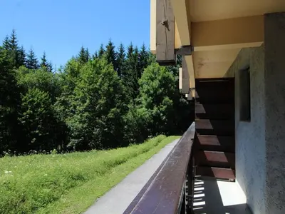 a ledge of a building with a view of a field at Studio au pied des pistes avec terrasse – 4 pers, lave-vaisselle & lave-linge - FR-1-572-135 in Arâches-la-Frasse
