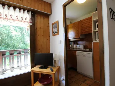 a kitchen with a desk with a computer and a window at Studio au pied des pistes avec terrasse – 4 pers, lave-vaisselle & lave-linge - FR-1-572-135 in Arâches-la-Frasse