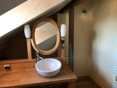 a bathroom with a white sink and a mirror at Chambres à Sallanches in Sallanches