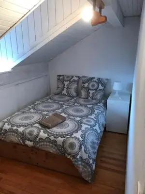 a bedroom with a bed in a room with at Chambres à Sallanches in Sallanches