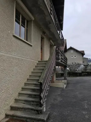 a set of stairs next to a building at Chambres à Sallanches in Sallanches