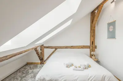 a bedroom with two teddy bears on a bed at Appartement Soffitta - Welkeys in Chamonix-Mont-Blanc