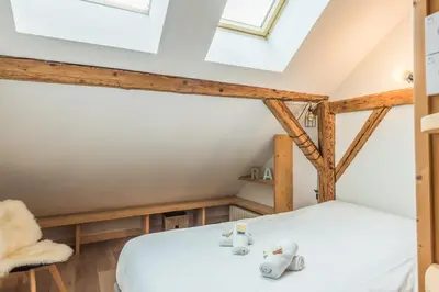 a room with a bed in a attic at Appartement Soffitta - Welkeys in Chamonix-Mont-Blanc