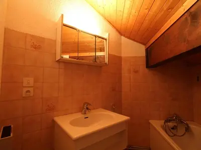 a bathroom with a sink and a mirror at Appartement cosy 6 pers. au pied des pistes, balcon sud-ouest, proche centre, ski-in/ski-out - FR-1-572-155 in Arâches-la-Frasse