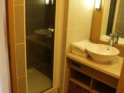 a bathroom with a glass shower and a sink at Appartement 3 pièces à Flaine, Résidence de Luxe avec Piscine, Spa et Salle de Sport, Pied des Pistes - FR-1-687-6 in Flaine