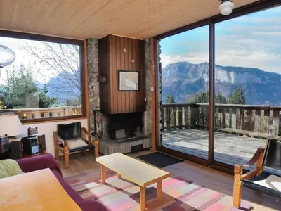 a living room with a view of a mountain at Chalet 3 chambres, 8 pers, terrasse sud, proche remontées, équipements complets - FR-1-572-216 in Arâches-la-Frasse