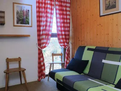 a bedroom with a bed and a window with curtains at Chalet 3 chambres, 8 pers, terrasse sud, proche remontées, équipements complets - FR-1-572-216 in Arâches-la-Frasse