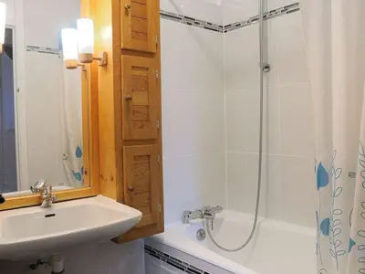 a bathroom with a sink and a shower at Chalet 3 chambres, 8 pers, terrasse sud, proche remontées, équipements complets - FR-1-572-216 in Arâches-la-Frasse