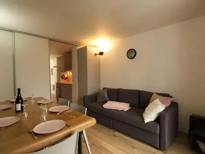 a living room with a couch and a table at Appartement rénové 3 pièces - 6 pers - Balcon Sud - Résidence Sirius à Flaine Forêt - FR-1-687-5 in Arâches-la-Frasse
