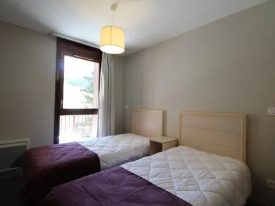 a bedroom with two beds and a window at Flaine: 4P au pied des pistes, piscine, parking, 8 pers - FR-1-687-15 in Arâches-la-Frasse