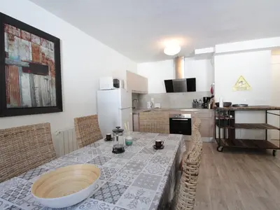 a kitchen with a table and chairs and a kitchen with a kitchen at Appartement 3 pièces pour 6 personnes à 350m des pistes – Résidence Petite Ourse, Flaine Forêt - FR-1-687-16 in Arâches-la-Frasse