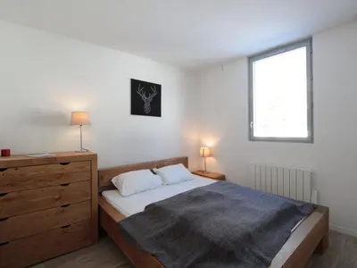 a bedroom with a bed and a dresser and a window at Appartement 3 pièces pour 6 personnes à 350m des pistes – Résidence Petite Ourse, Flaine Forêt - FR-1-687-16 in Arâches-la-Frasse