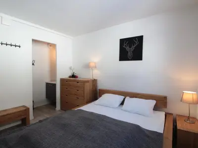 a bedroom with a bed and a dresser with two lamps at Appartement 3 pièces pour 6 personnes à 350m des pistes – Résidence Petite Ourse, Flaine Forêt - FR-1-687-16 in Arâches-la-Frasse