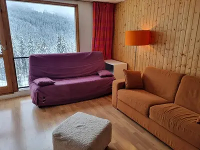 a living room with a couch and a chair at Appartement Rénové - 2 Pièces, 6 Pers, Pied des Pistes - Résidence Cassiopée, Flaine Forum - FR-1-687-32 in Arâches-la-Frasse