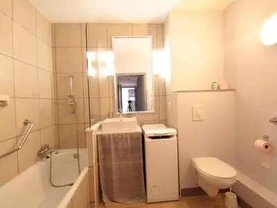 a bathroom with a sink and a toilet and a mirror at Appartement 3 pièces pour 8 personnes aux pieds des pistes à Flaine - FR-1-687-44 in Arâches-la-Frasse