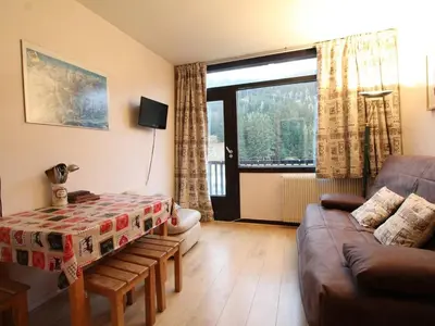 a living room with a couch and a table at Studio confortable 4 pers, au pied des pistes de Flaine avec balcon - FR-1-687-28 in Arâches-la-Frasse