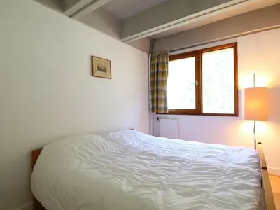 a bedroom with a white bed and a window at Appartement 3 pièces rénové, 8 pers, proche pistes, Wifi - FR-1-687-23 in Arâches-la-Frasse