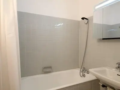 a bathroom with a white tub and a sink at Appartement 3 pièces rénové, 8 pers, proche pistes, Wifi - FR-1-687-23 in Arâches-la-Frasse