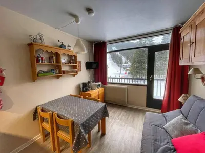 a living room with a table and a couch at Studio pour 4 pers à Flaine, au pied des pistes - FR-1-687-60 in Arâches-la-Frasse