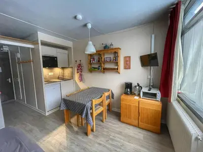 a small room with a table and a kitchen at Studio pour 4 pers à Flaine, au pied des pistes - FR-1-687-60 in Arâches-la-Frasse