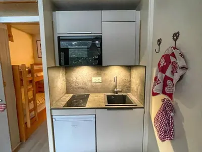 a small kitchen with a sink and a microwave at Studio pour 4 pers à Flaine, au pied des pistes - FR-1-687-60 in Arâches-la-Frasse