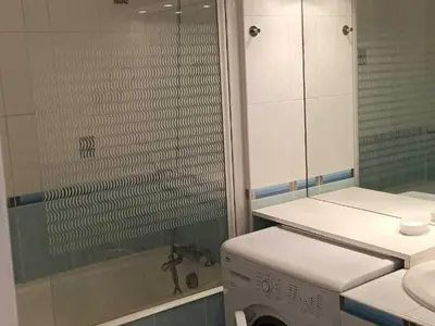 a bathroom with a shower and a washing machine at Appartement 2 Pièces avec Balcon, Proche Pistes - FR-1-687-56 in Arâches-la-Frasse