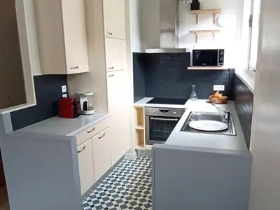 a kitchen with white cabinets and a stove top oven at Appartement 2 Pièces avec Balcon, Proche Pistes - FR-1-687-56 in Arâches-la-Frasse