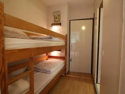 a room with two bunk beds and a hallway at Studio 4 pers, lave-vaisselle, proche pistes et commerces, navette gratuite - FR-1-687-47 in Arâches-la-Frasse