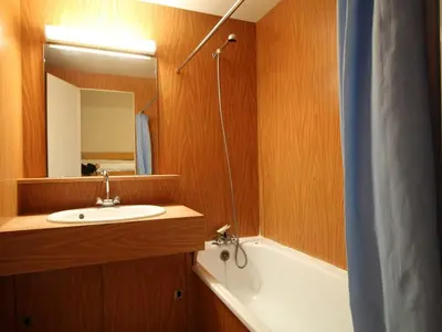 a bathroom with a sink and a tub and a mirror at Studio 4 pers, lave-vaisselle, proche pistes et commerces, navette gratuite - FR-1-687-47 in Arâches-la-Frasse