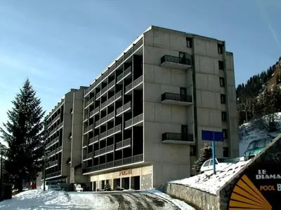 a large building with snow in front of it at Studio 4 pers, lave-vaisselle, proche pistes et commerces, navette gratuite - FR-1-687-47 in Arâches-la-Frasse