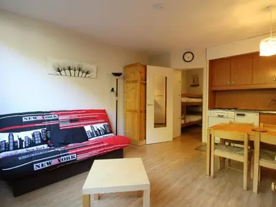 a living room with a boat hanging on the wall at Studio 4 pers, lave-vaisselle, proche pistes et commerces, navette gratuite - FR-1-687-47 in Arâches-la-Frasse